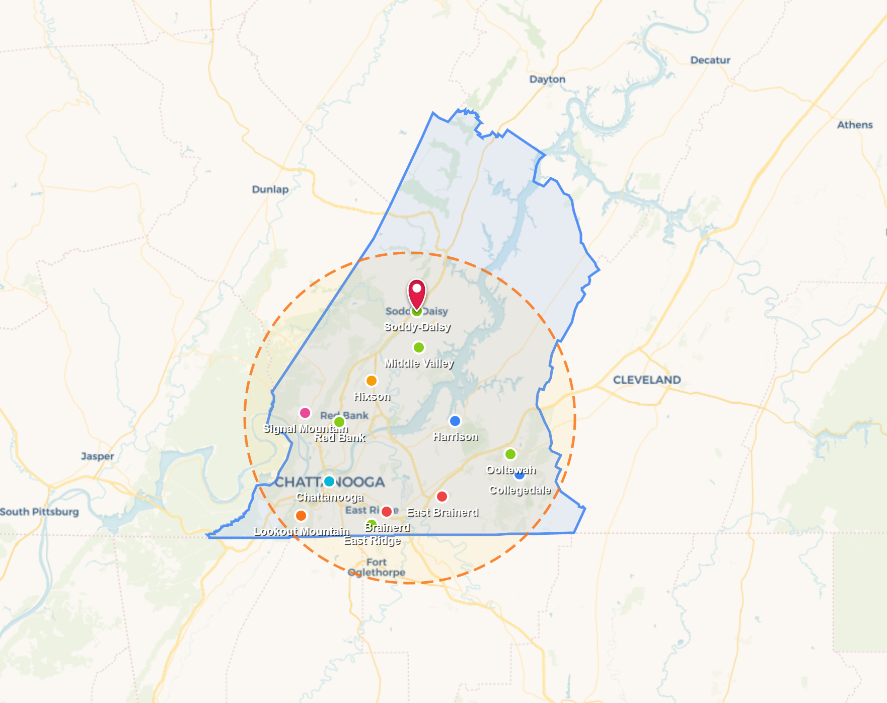 Map of a city with colored boundary outlines and a marked central point on a pale background