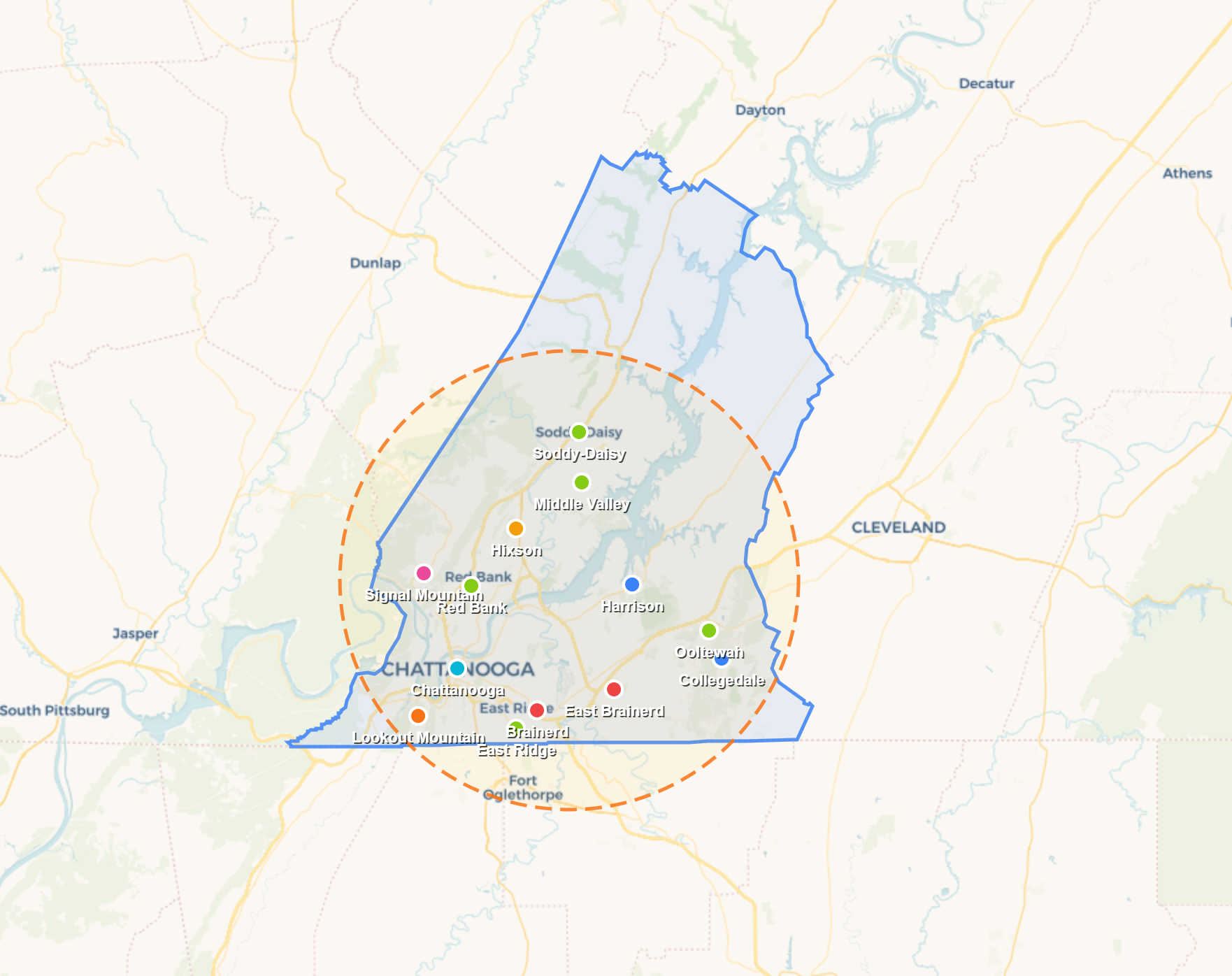 Map with green and blue outlined regions, a red location pin, and a dashed orange radius circle.