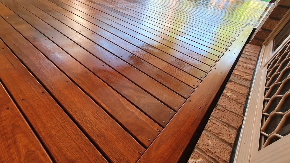 Wooden Deck with Brown Planks and Brick Wall — Toowoomba Polished Floors in Crows Nest, QLD
