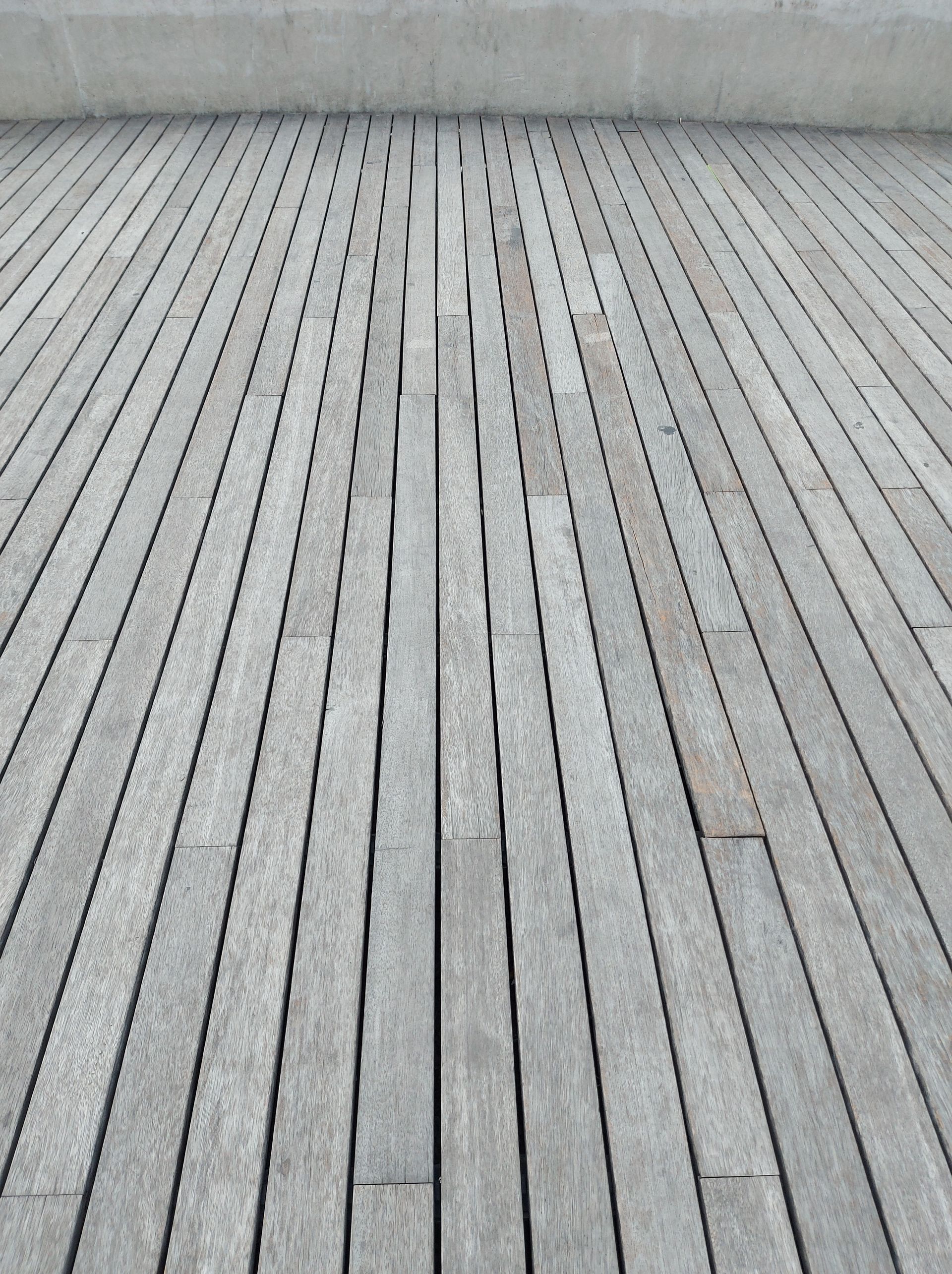 Grey Wooden Boardwalk Perspective Leading to A Concrete Wall — Toowoomba Polished Floors in Esk, QLD