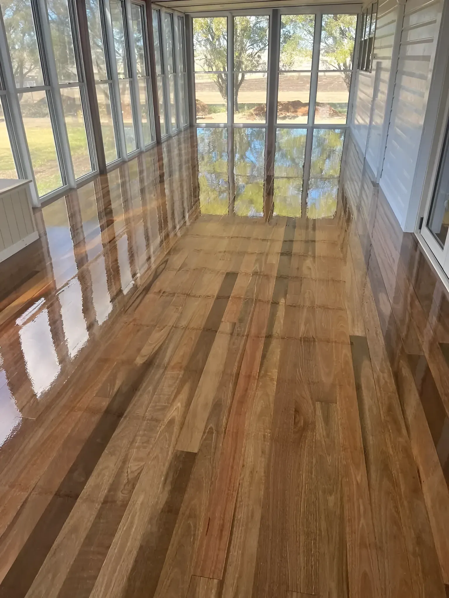 Sunroom with Shiny Reflective Wood Floor — Toowoomba Polished Floors in Warwick, QLD