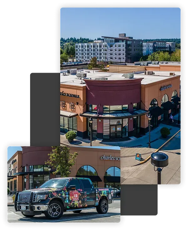 A truck is parked in front of a building.