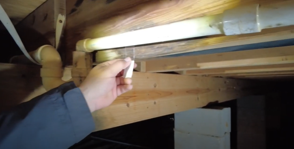 Inspecting for hidden mold behind walls and in crawl spaces