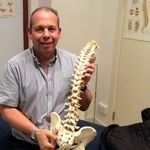 Anthony Kanutin holding spinal structure