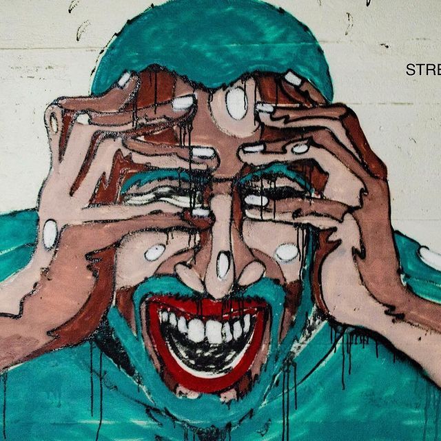 Person holding head in hands