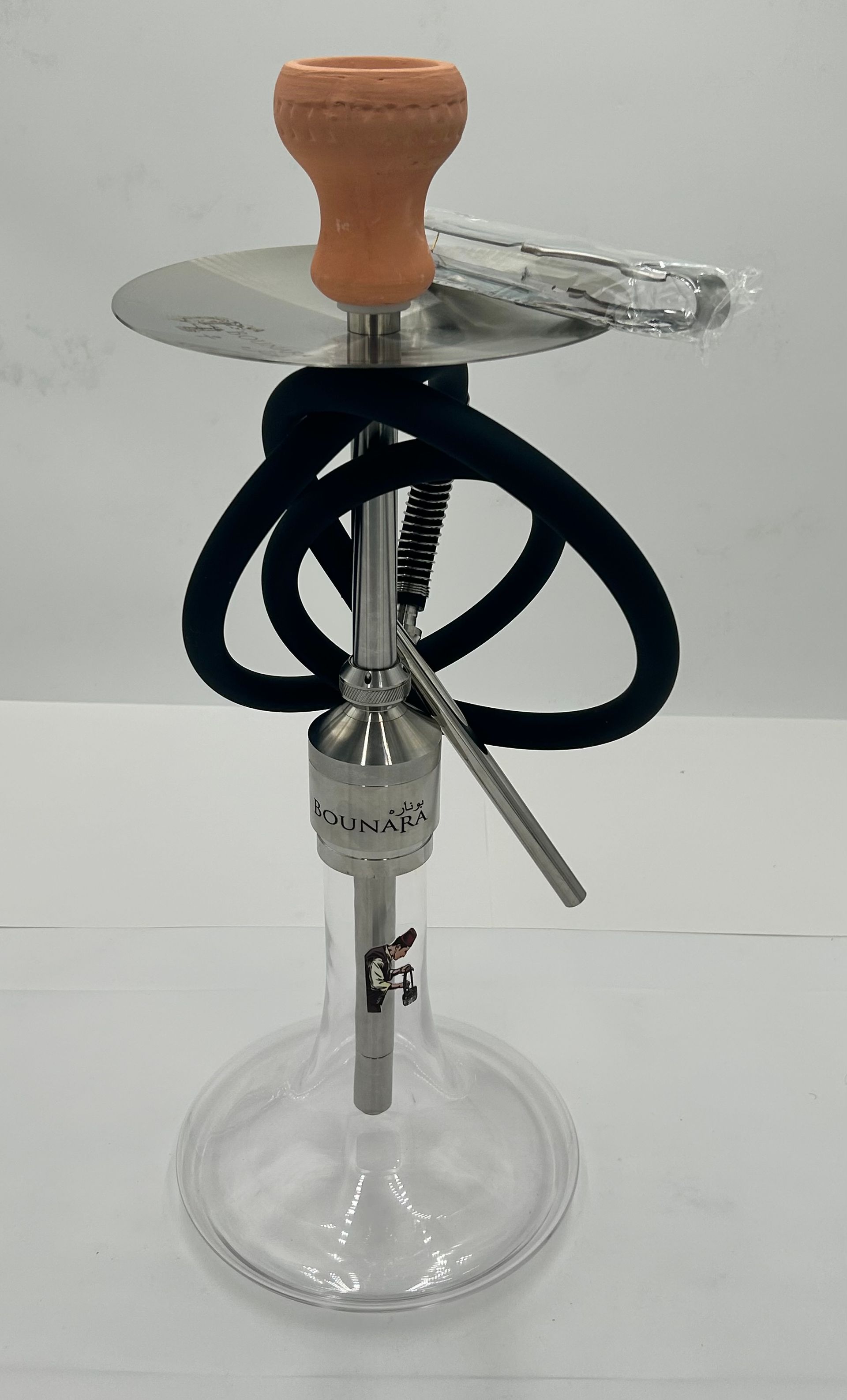 Hookah set with silver metal stem, black hose, bowl, and carrying bag on a white backdrop.