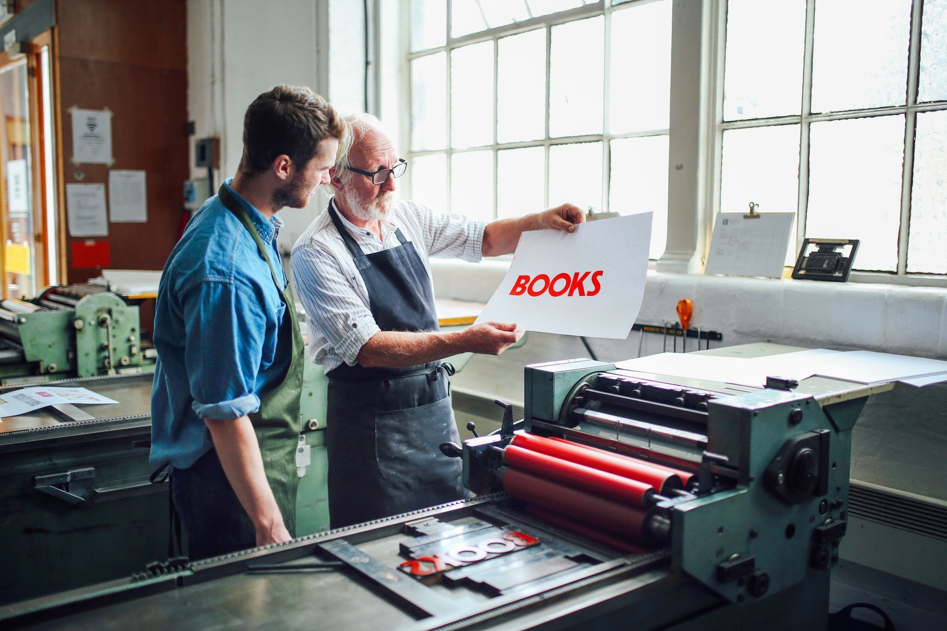 A person shows a printed sheet with the word 