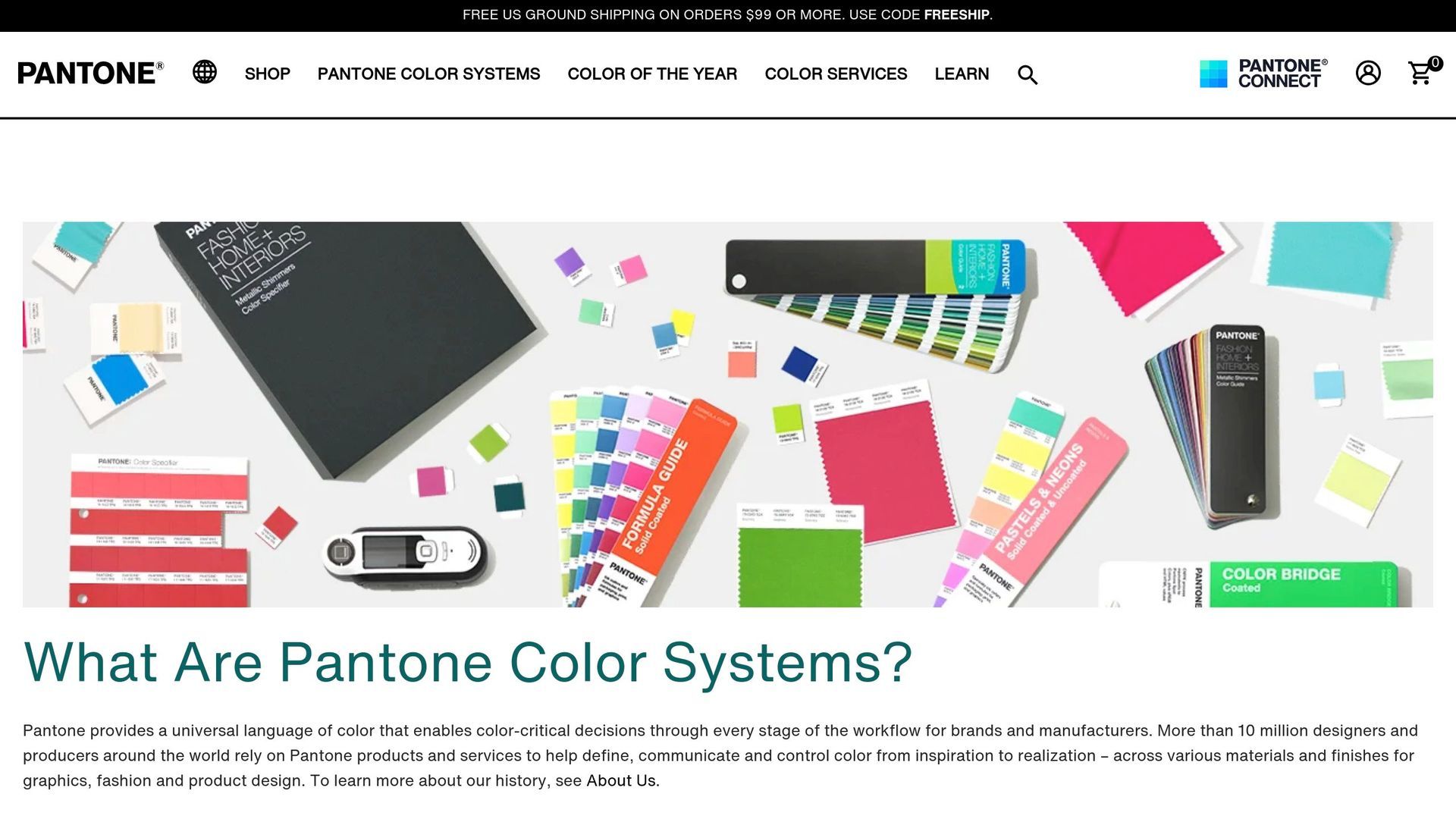 A flat-lay view of various Pantone color guides, fabric swatches, and a color-matching device on a neutral background.