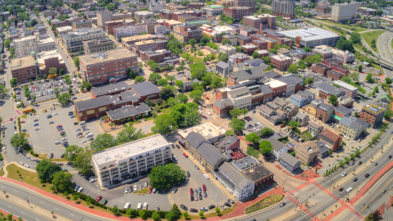 An aerial view of a city with lots of buildings and trees.