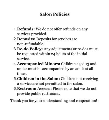 A white sheet of paper with a list of salon policies on it.