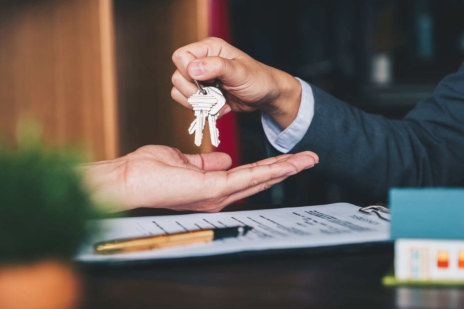 Estate Agent Giving House Keys — Nashua, NH — ALEXANDER S. BUCHANAN PLLC