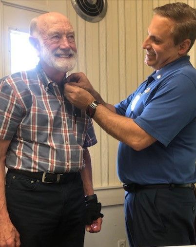 Alec Buchanan is sworn in as President of the Milford NH Rotary Club