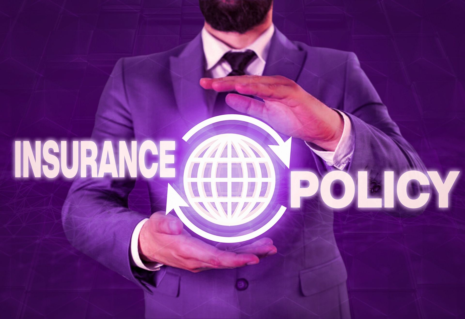 a man in a suit and tie is holding a globe in his hands .