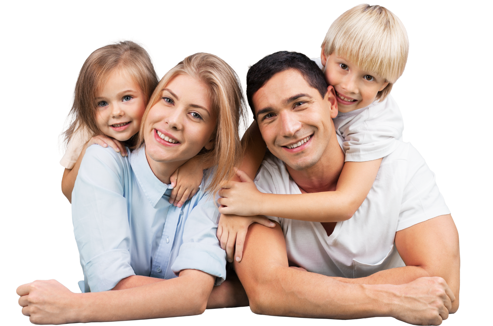 a family is laying on the floor together and smiling for the camera .