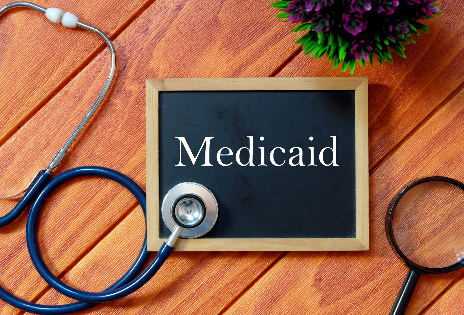 a blackboard with the word medicaid written on it