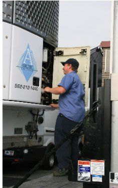 Man Checking The Refrigerated Trailer — Mobile Refrigerated Trailer Repairs — Arctic Services 562-212-1440 Man Checking The Refrigerated Trailer — Mobile Refrigerated Trailer Repairs — Arctic Services 562-212-1440