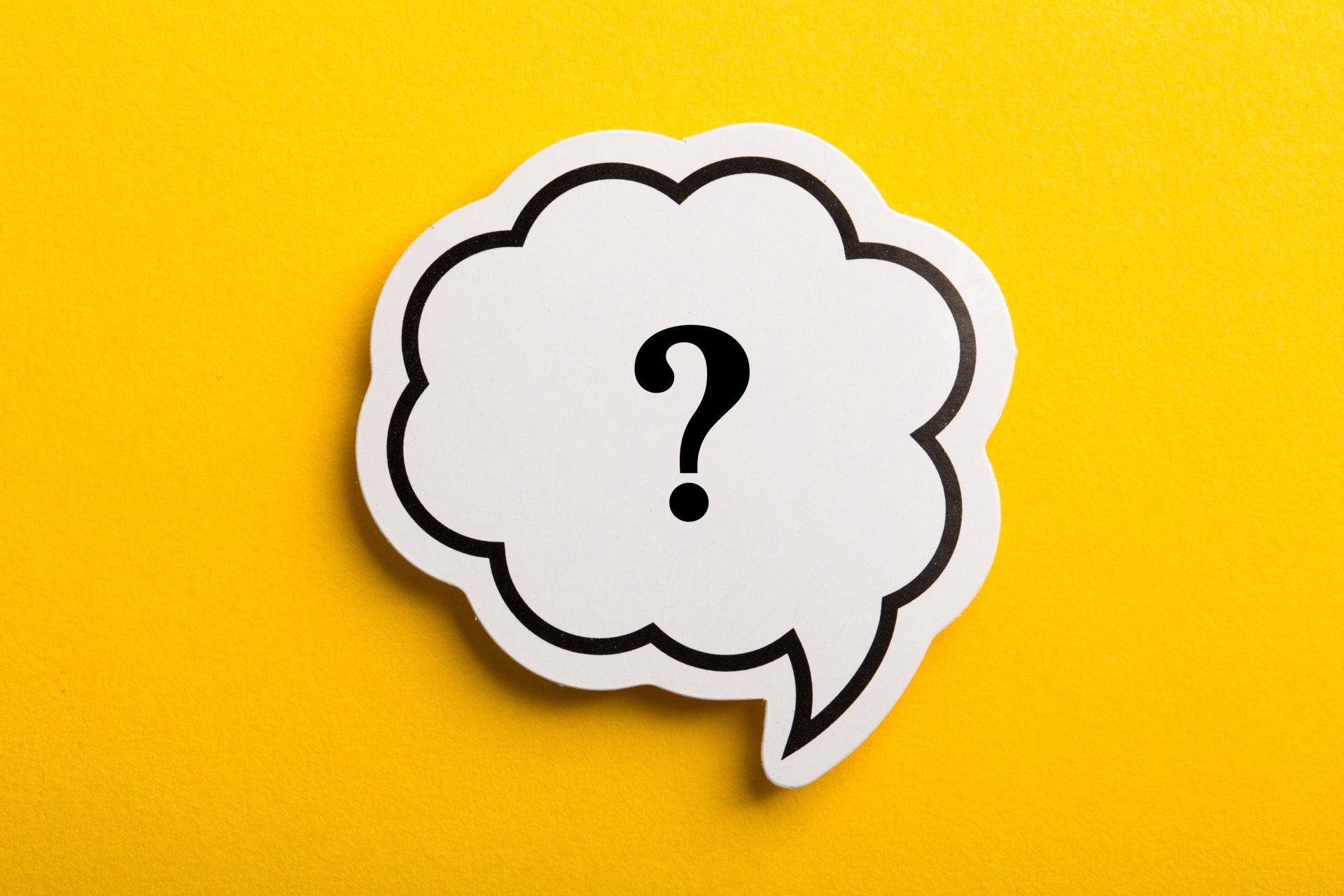 Question mark speech bubble isolated on yellow background.