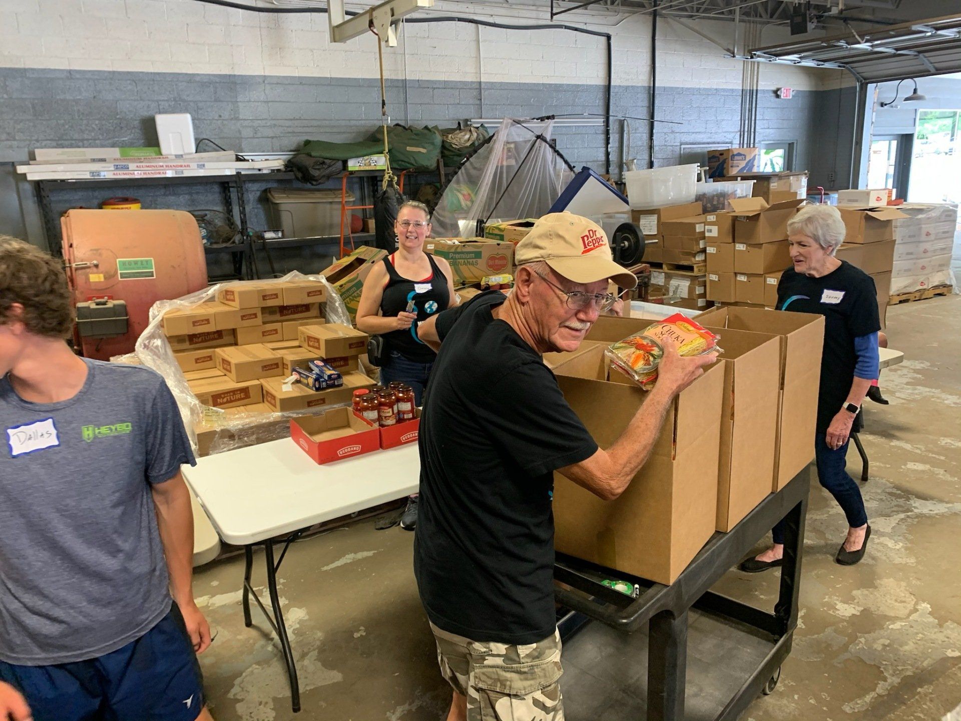 A group of people are working in a warehouse.