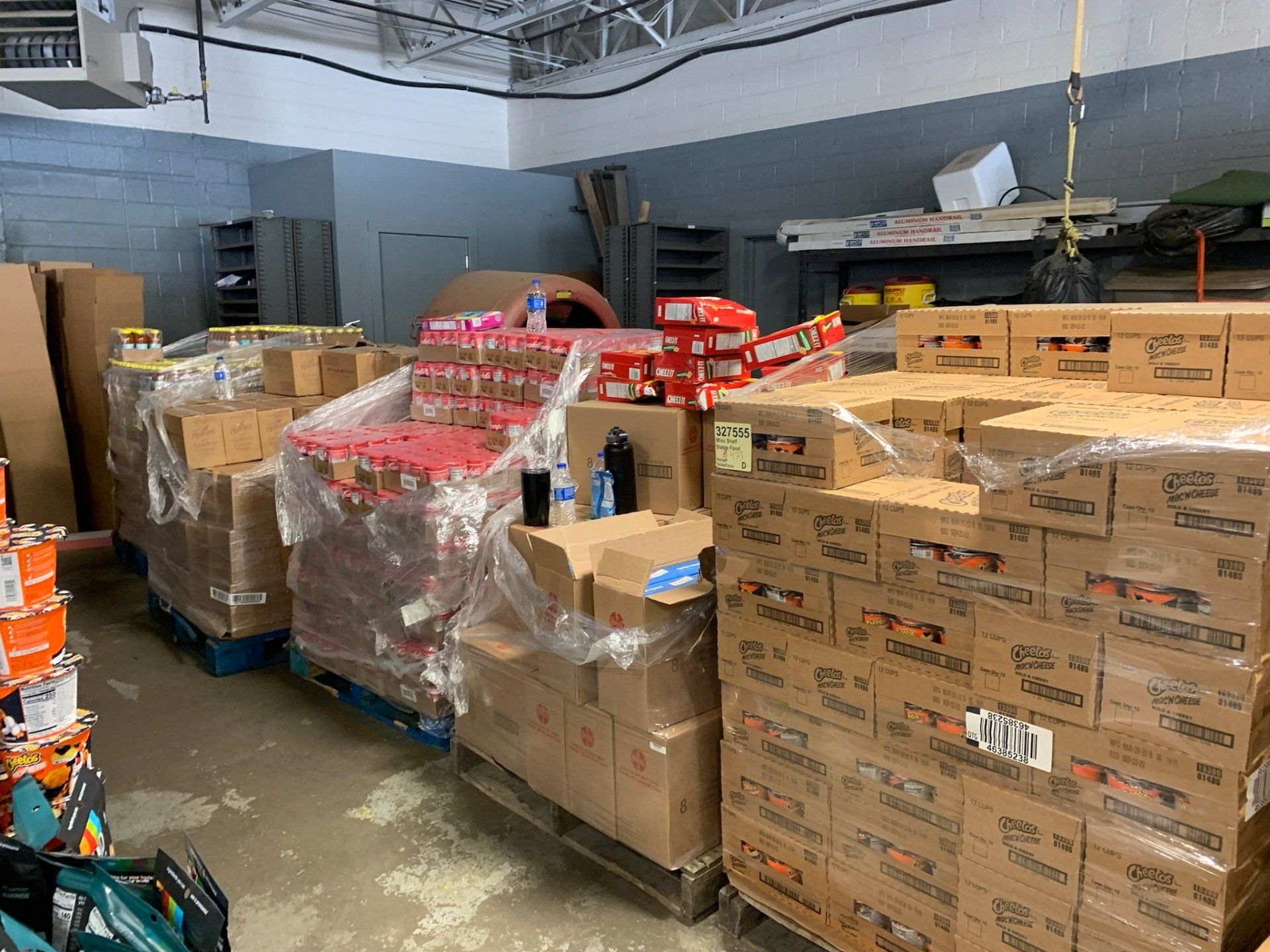 A warehouse filled with lots of boxes and pallets.