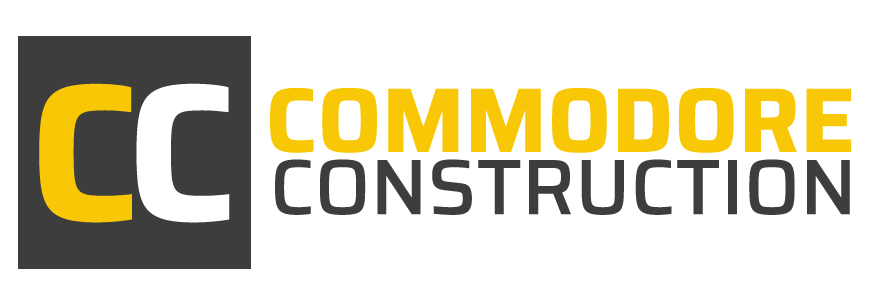 Commodore Construction logo with yellow and gray “CC” icon and company name in black and yellow text
