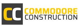 Commodore Construction logo with yellow and gray “CC” icon and company name in black and yellow text