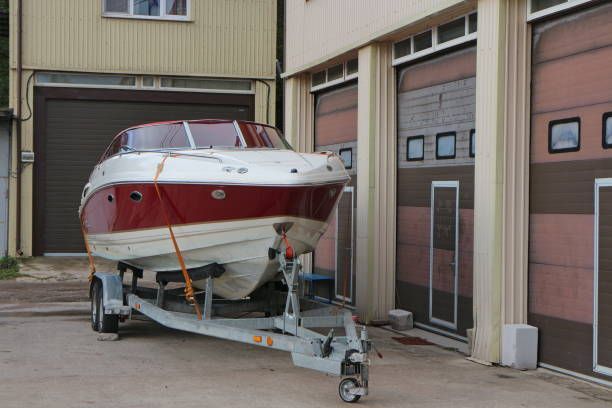 Boat on a trailer in front of boat storage 