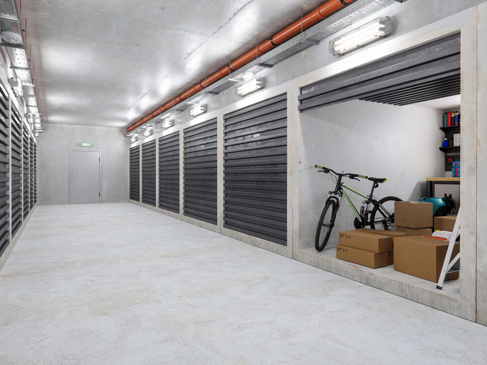 Self-storage warehouse with empty corridor and rows of secure storage units.