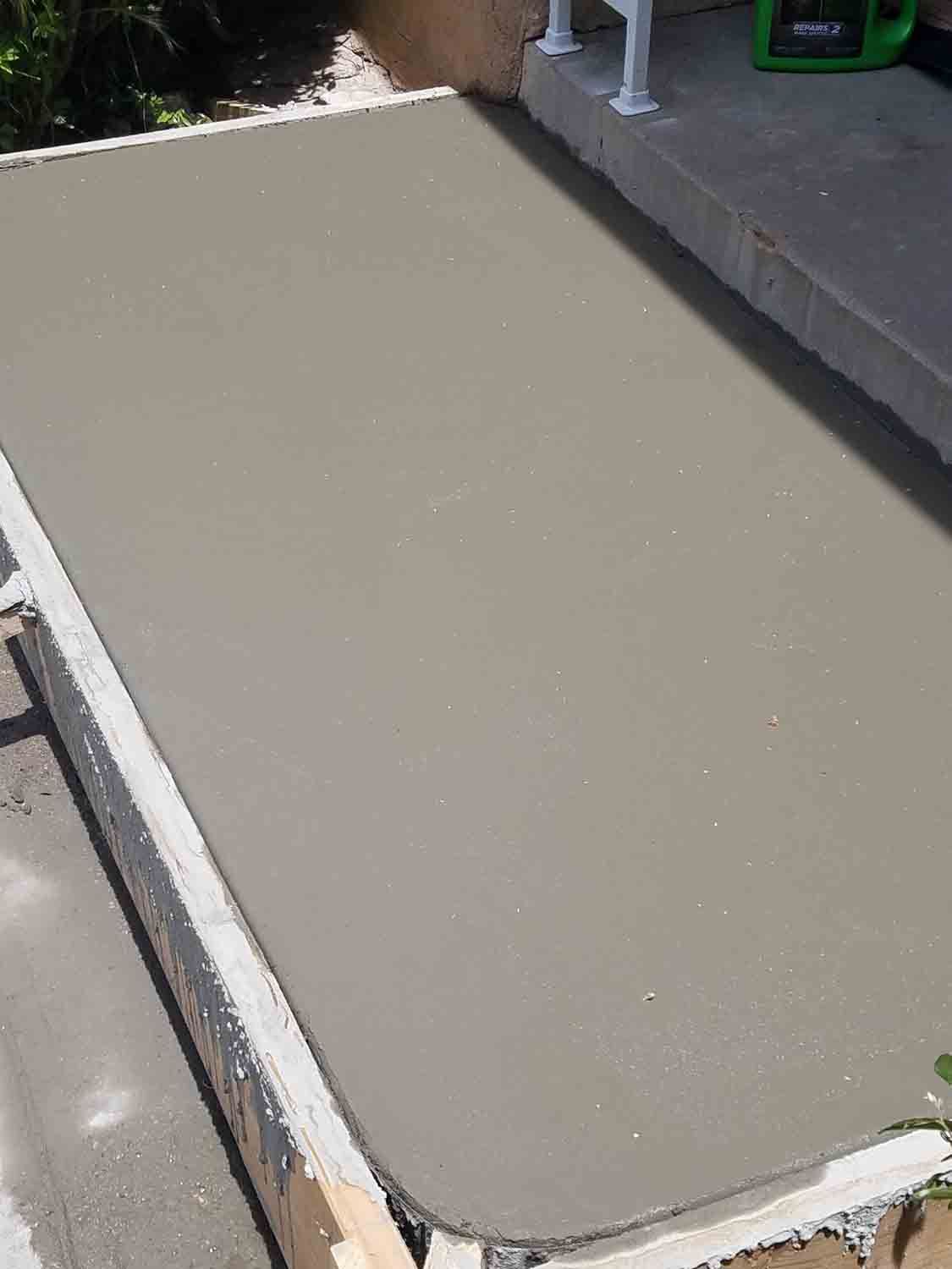 A piece of concrete is sitting on top of a concrete slab.