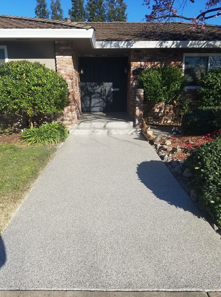 A house with a walkway leading to the front door