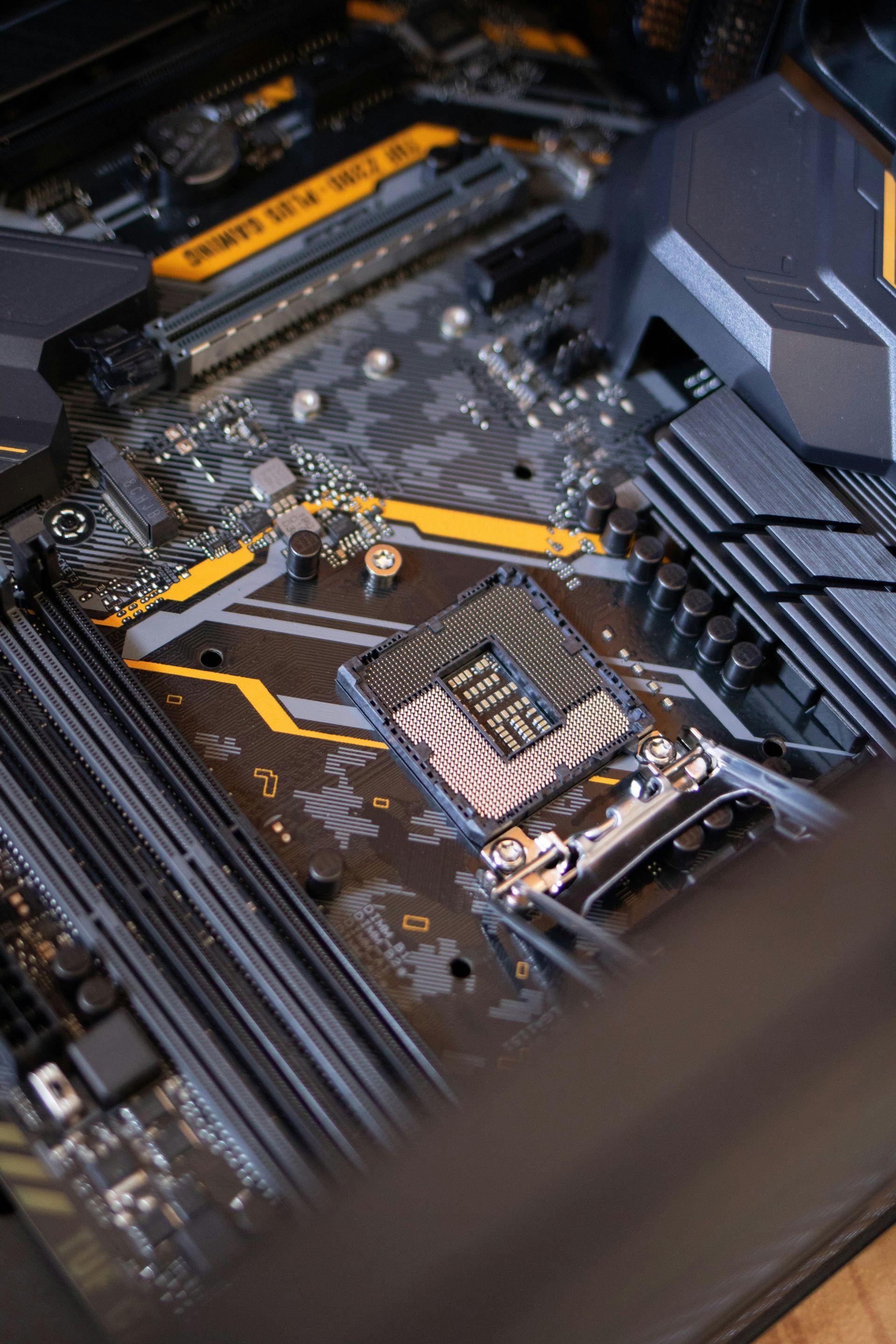 A close up of a computer motherboard with a lot of components on it.