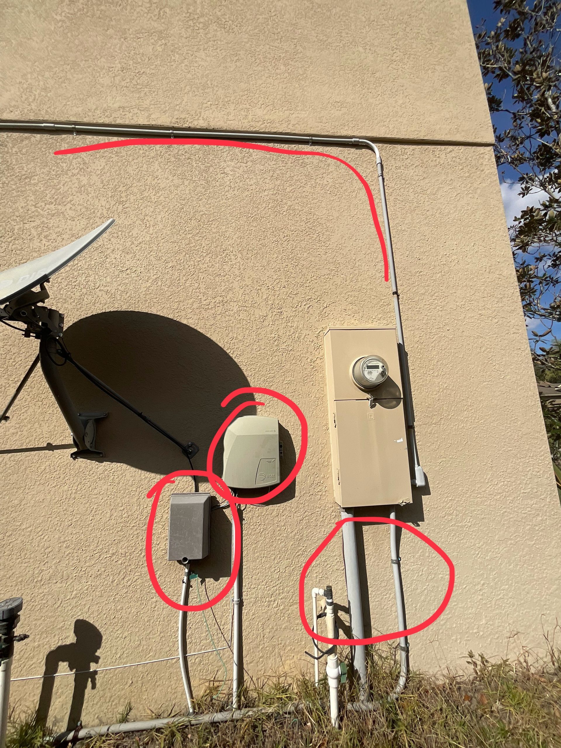 Professional stucco crack repairs during exterior house painting project in DeLand, FL
