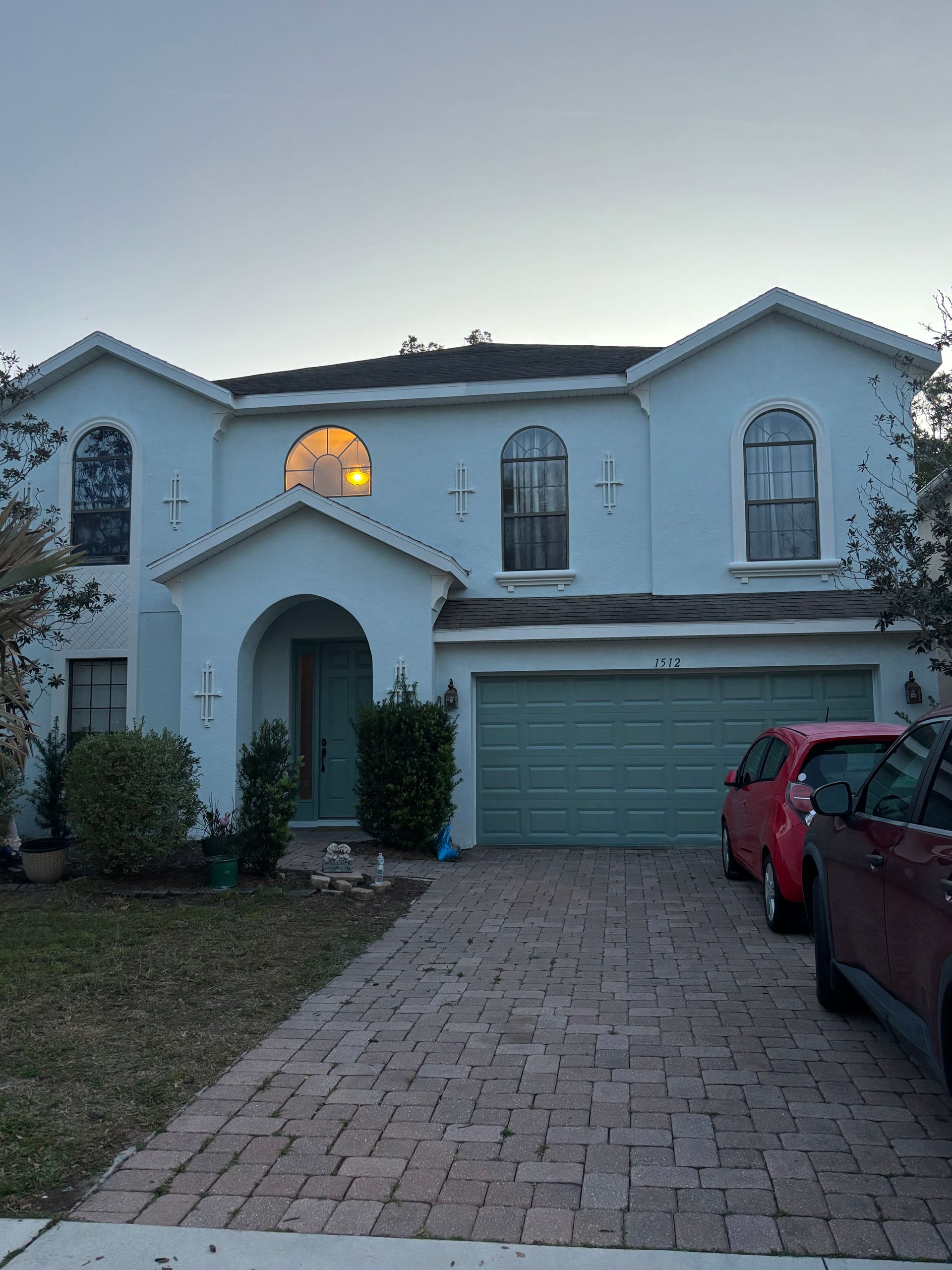 Beautiful exterior repaint featuring custom colors on a DeLand stucco home