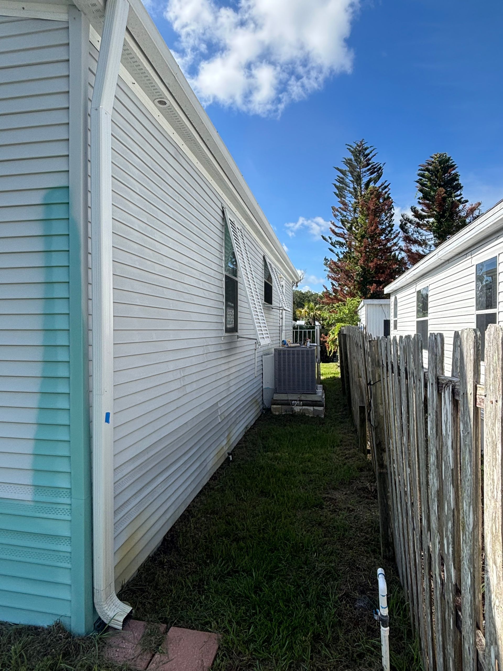Professional spray application on vinyl siding exterior in Edgewater