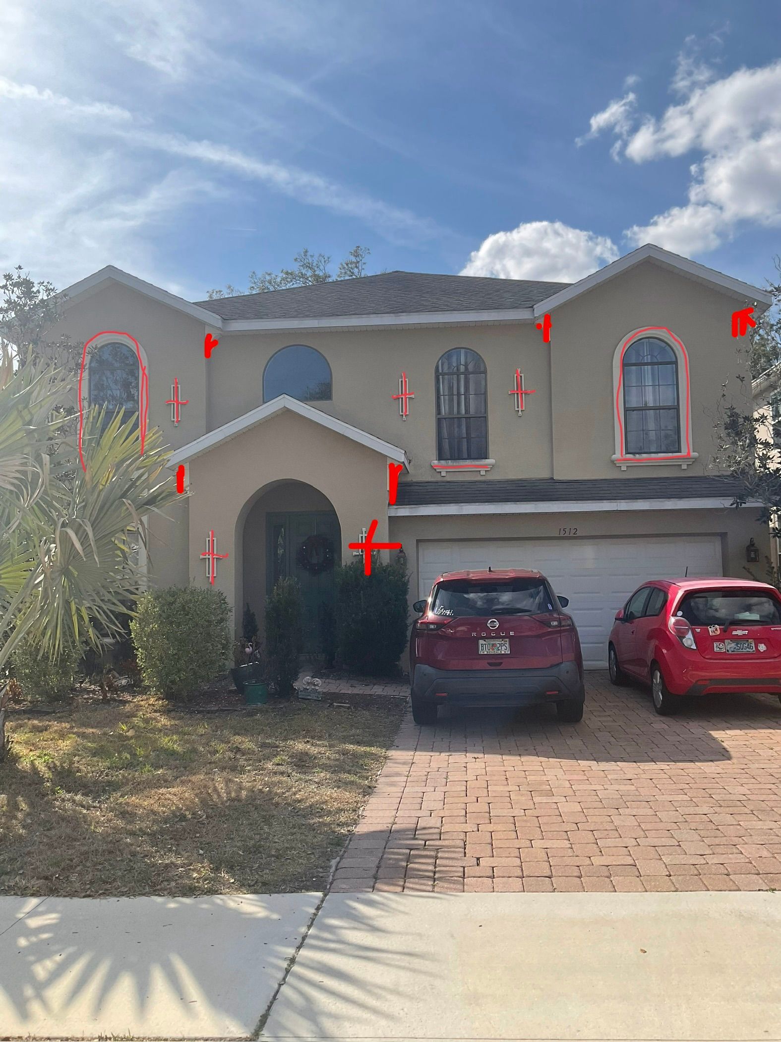 Before photo of a two-story stucco home in a DeLand, FL HOA before exterior repainting