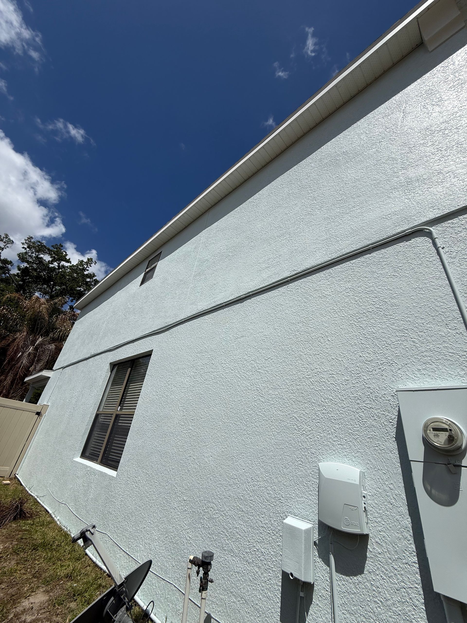 Detailed trim and soffit painting completed on a DeLand exterior repaint project