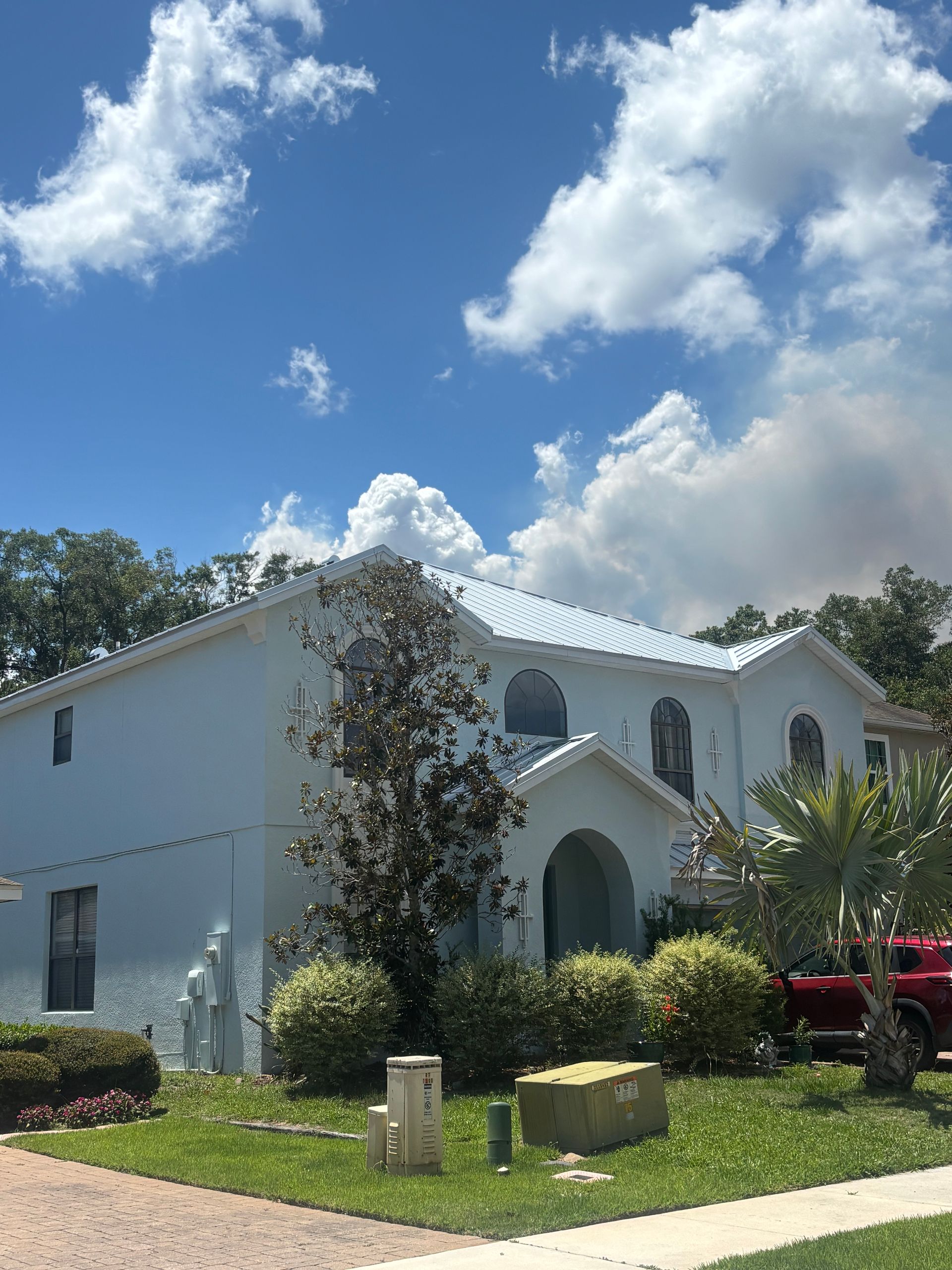Before and after exterior house painting transformation in DeLand using Sherwin-Williams Duration