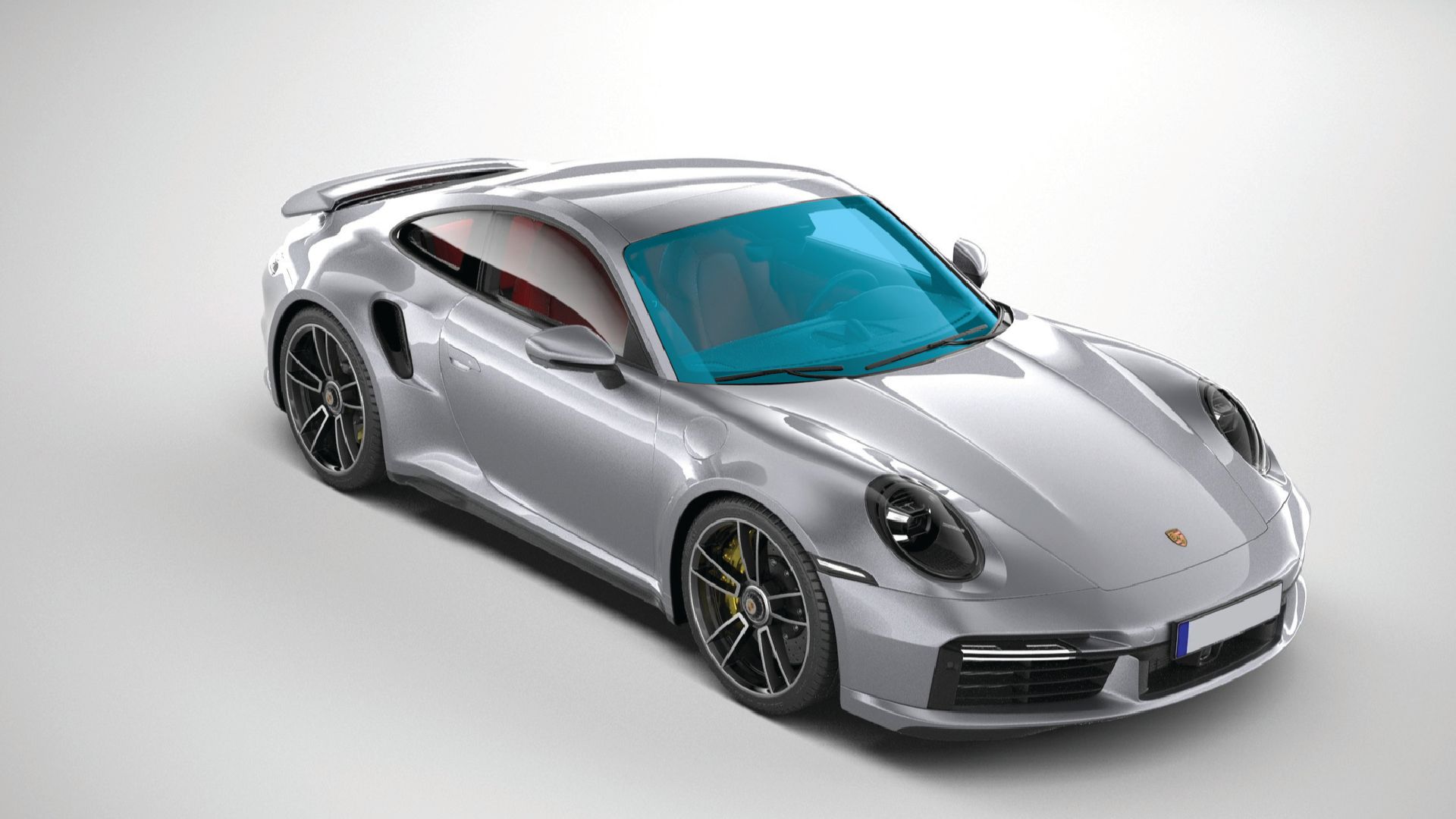 Silver sports car on a white studio background, angled front-left view showing windshield coating area