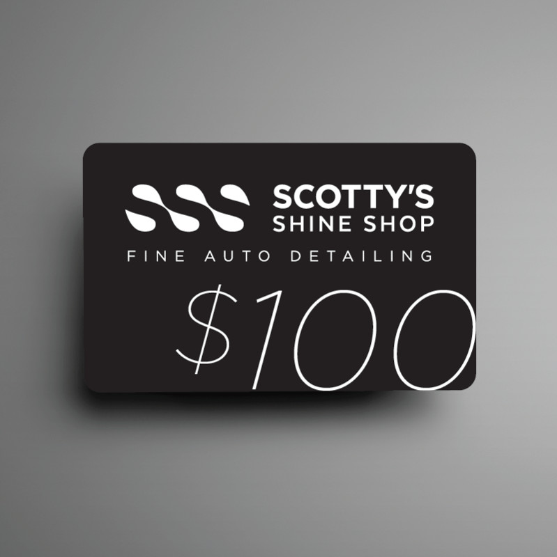 Black business card for Scotty's Shine Shop fine auto detailing with a large 