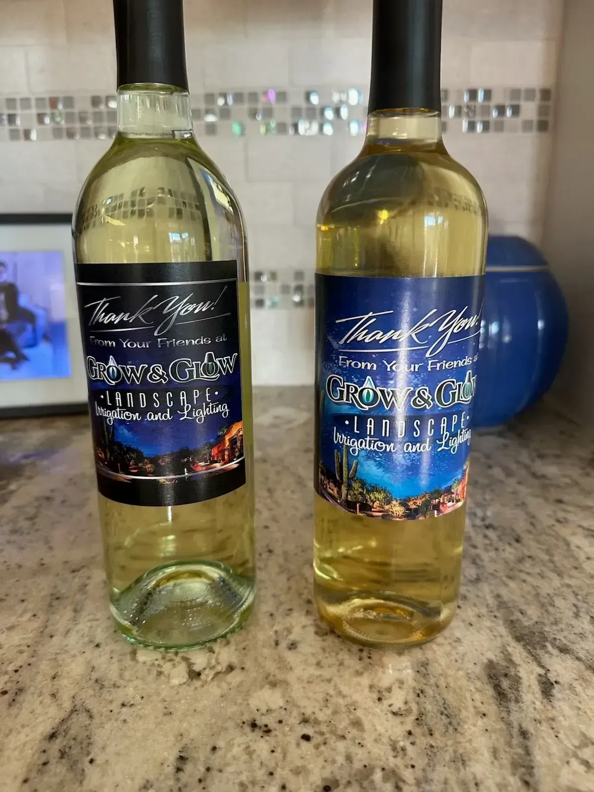 Two wine bottles with customized labels.