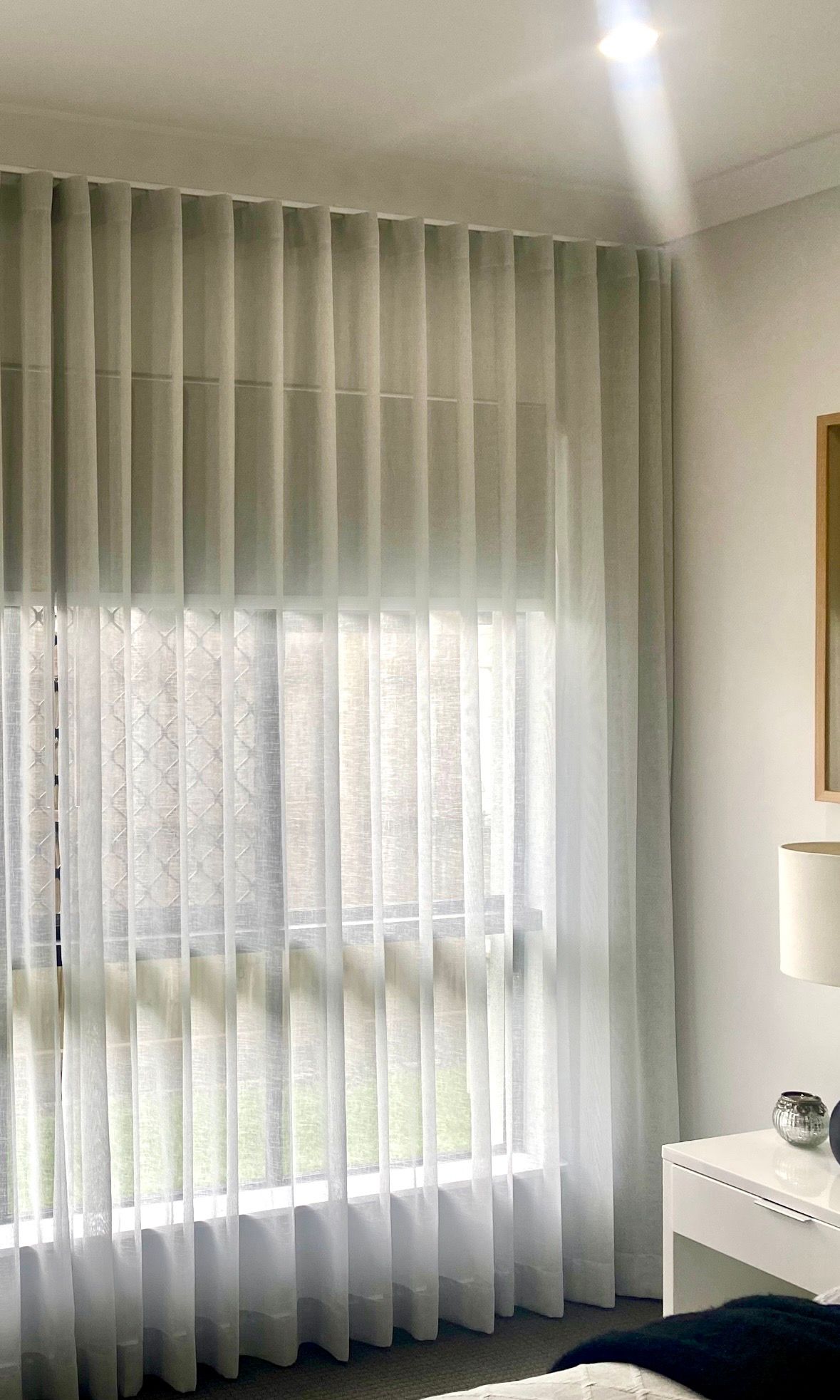 Blue Armchair by a Window With Sheer Curtains — Instyle Curtains & Blinds in Bungalow, QLD
