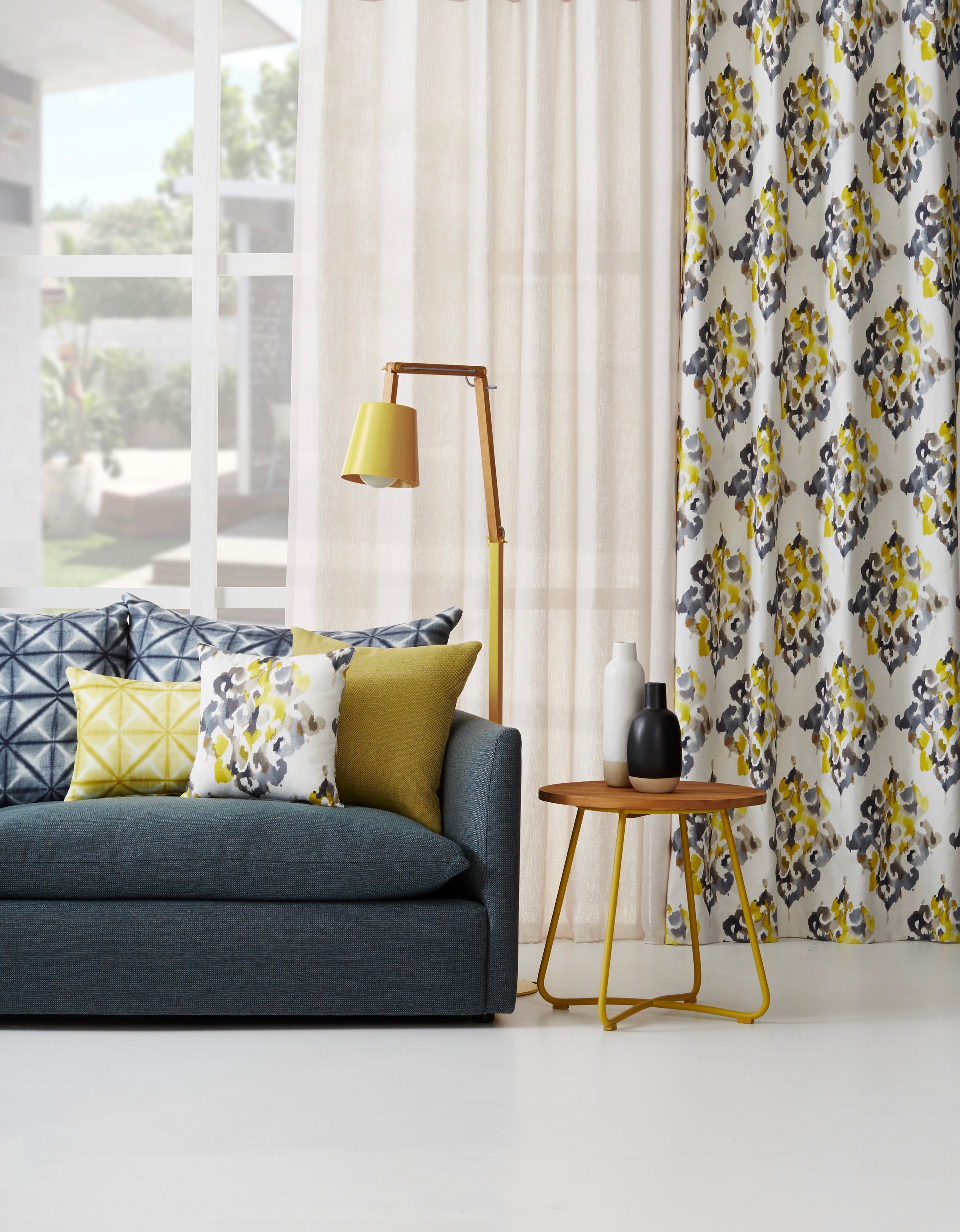 Elegant Bedroom With Blue Drapes — Instyle Curtains & Blinds in Bungalow, QLD