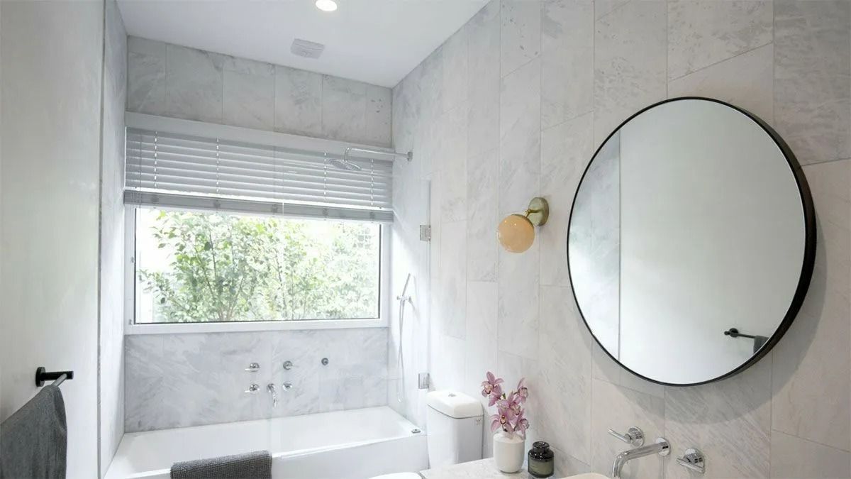 Modern Bathroom With Marble-look Tile — Instyle Curtains & Blinds in Bungalow, QLD