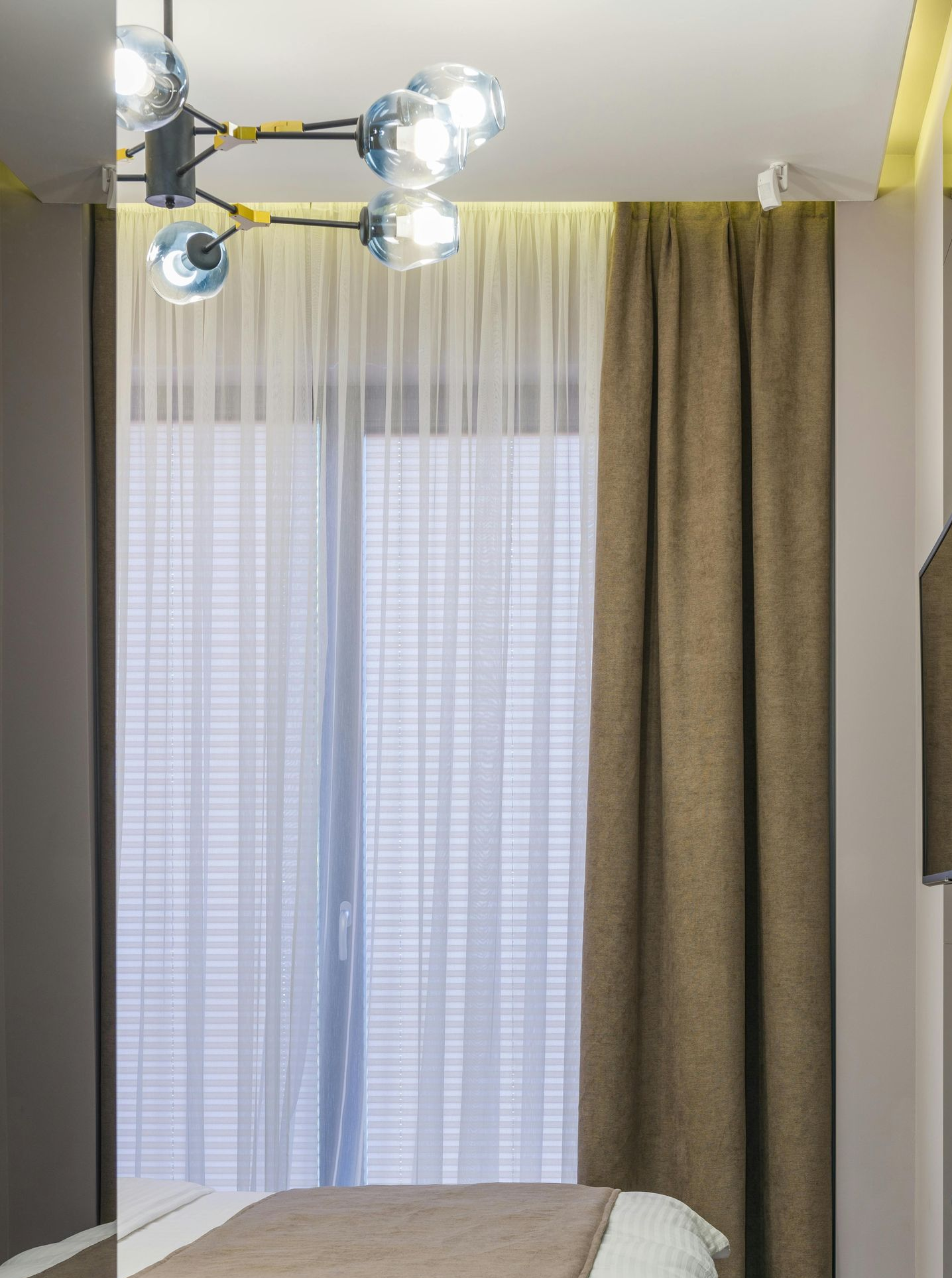 Bedroom With a Single Bed With White Linens — Instyle Curtains & Blinds in Bungalow, QLD