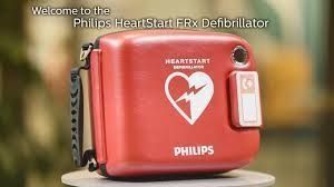 Red Philips HeartStart FRx defibrillator on a stand, with heart and lightning logo