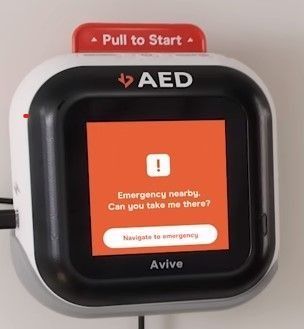 Red AED device screen shows “Emergency nearby, can you take me there?” with a Navigate to emergency button