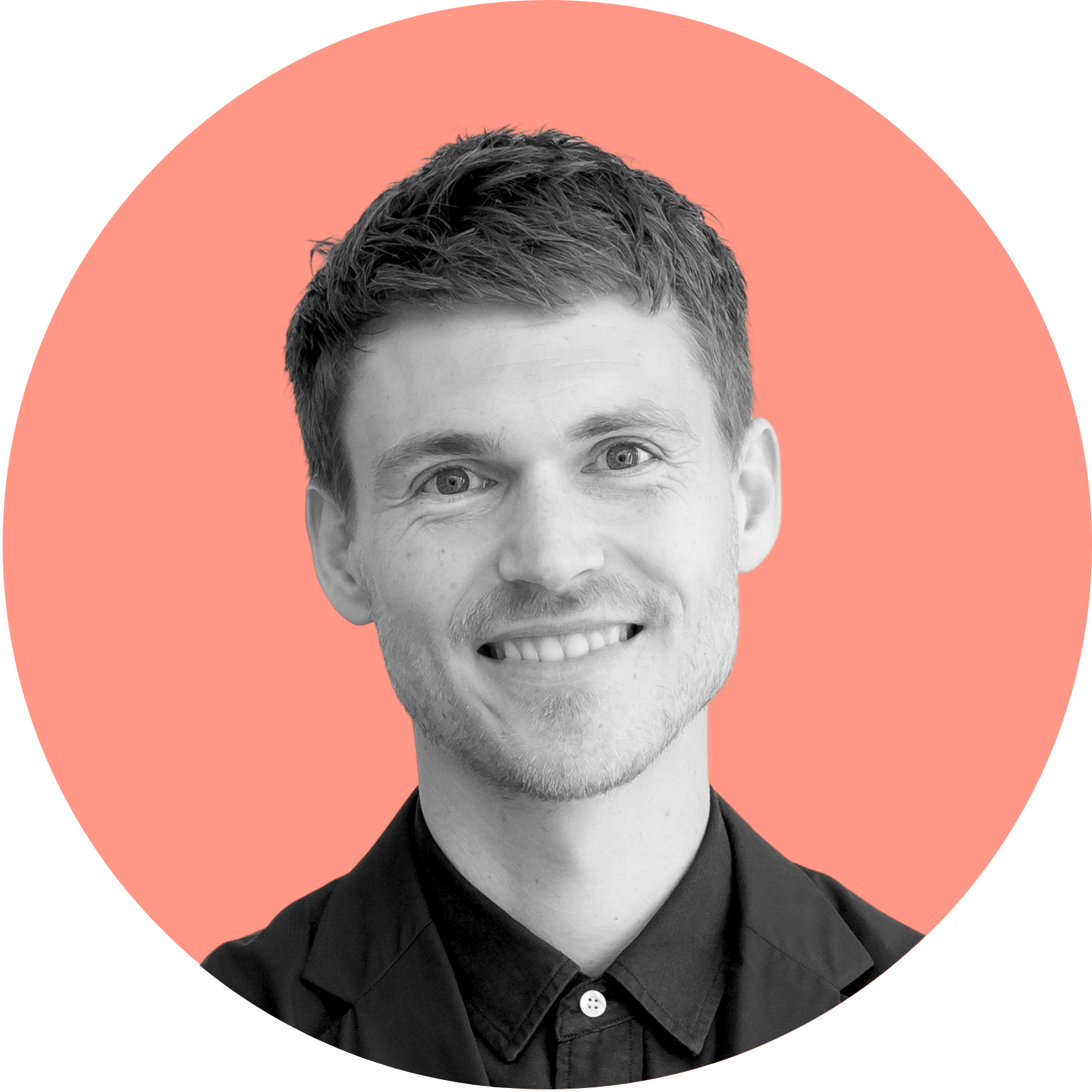 Smiling man in a black shirt, centered in a peach circle.