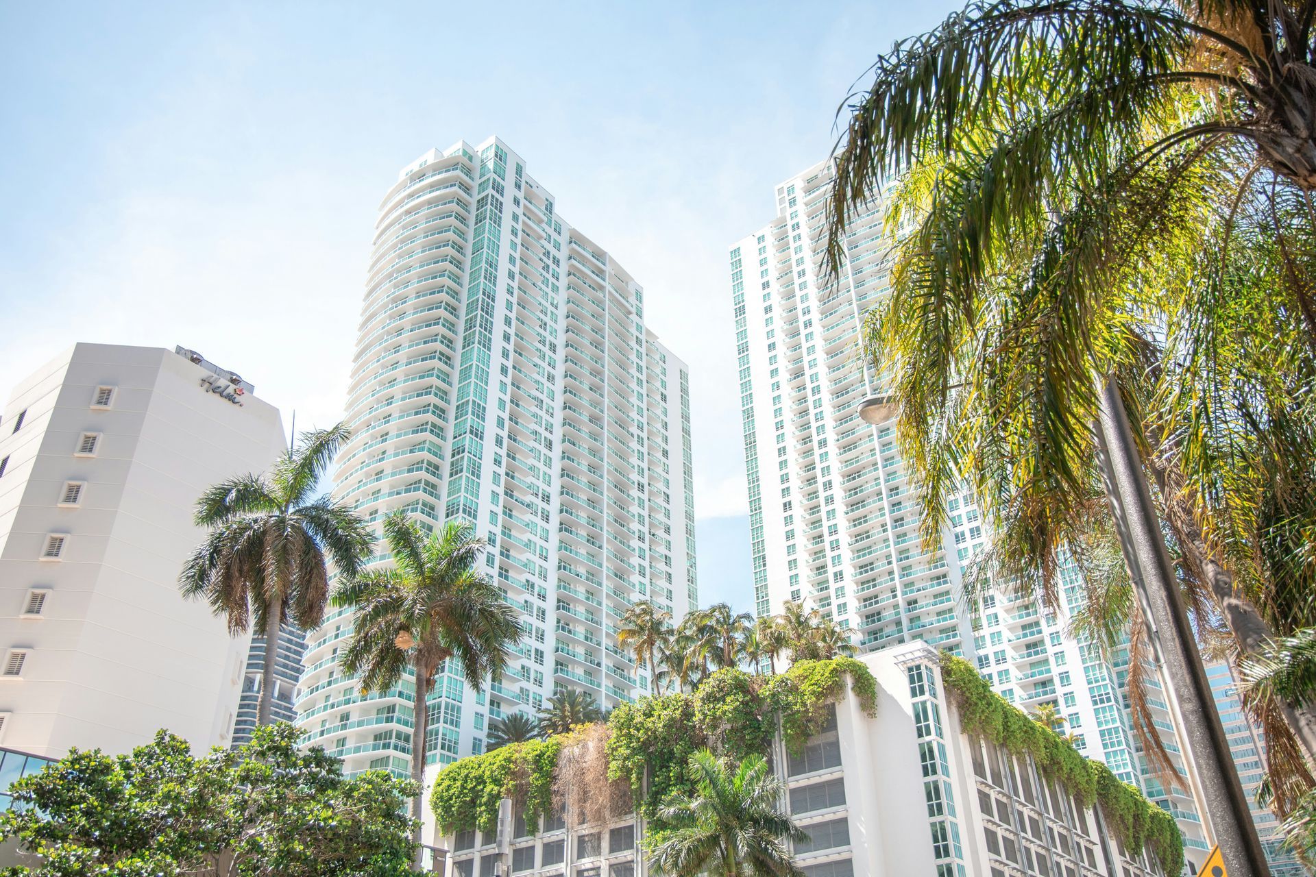 Skyscrapers and palm trees in Miami, Florida, on a sunny day.