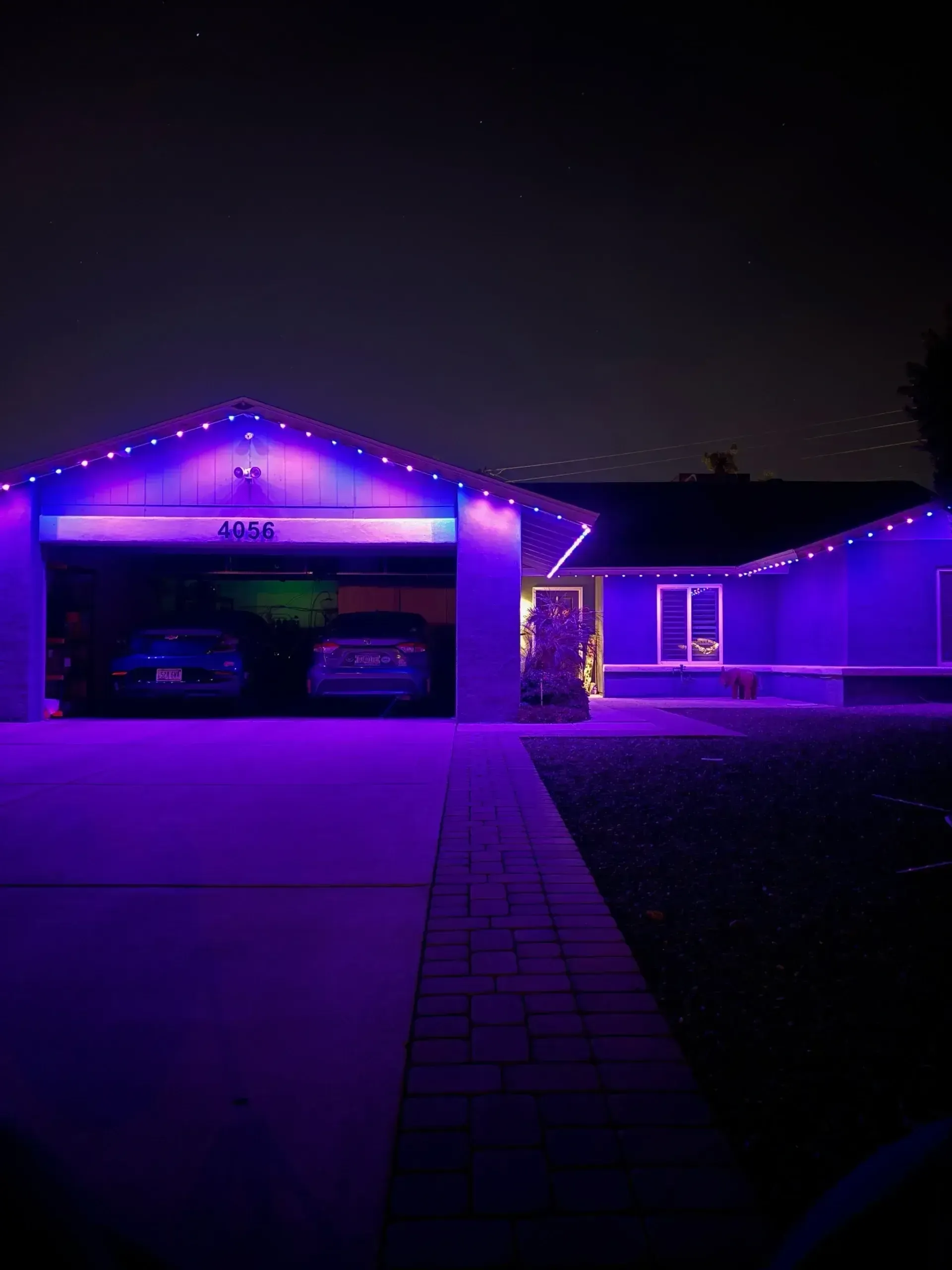 Home with colorful holiday lights and synchronized display