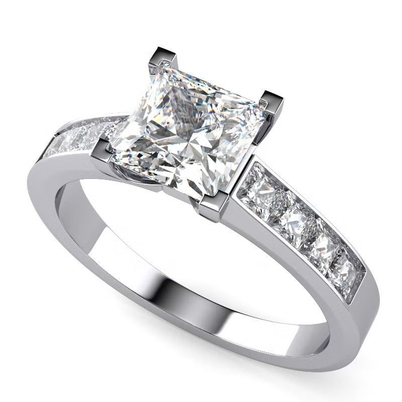 Silver ring with a large square-cut diamond and small side stones on the band