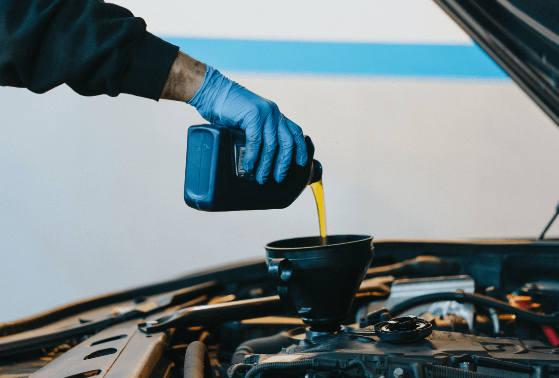 a mobile mechanic doing a fluid change